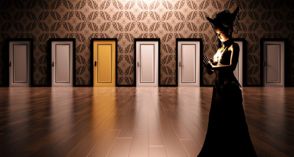 Gothic Victorian dressed woman standing in front of a row of doors.