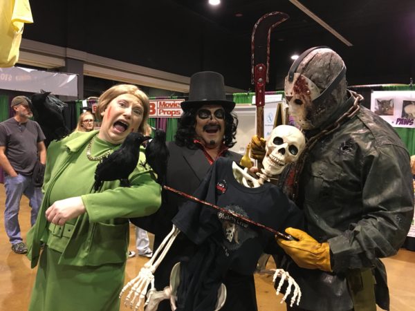 People dressed as Melanie Daniels being attacked by crows from Alfred Hitchcock's The Birds, Svengoolie and Jason Voorhees pose with skeleton at The ScareFest in Kentucky