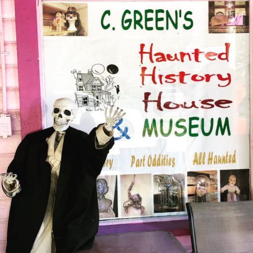 C. Green's Haunted History House and Museum sign