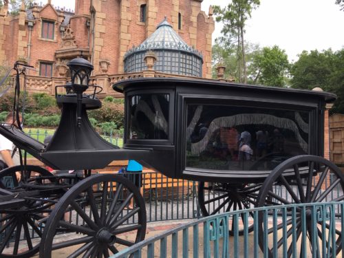 Phantom horse drawn hearse in front of the Magic Kingdom's Haunted Mansion