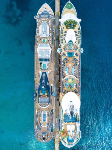 aerial view of side by side cruise ships