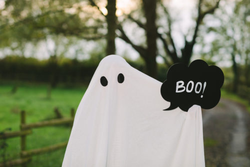 Sheet covered ghost holding Boo chalkboard photo prop cutout