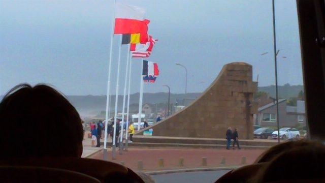 Flags and memorial at Omaha Beach