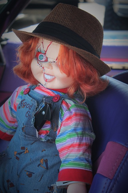 A Child's Play Chucky Doll sitting in a car