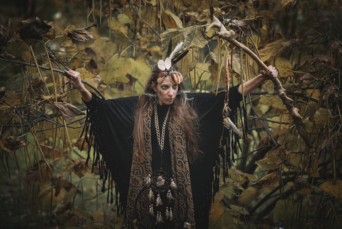 Native American woman in trees