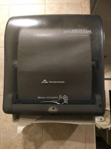 Motion activated paper towel dispenser