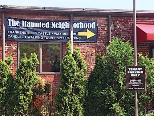 The Haunted Neighborhood sign