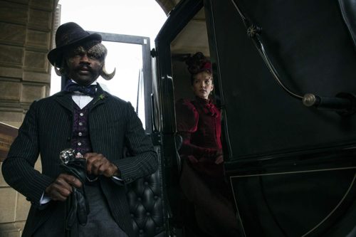 David Gyasi and Tamzin Merchant in Carnival Row (2019)