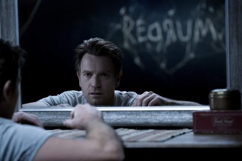 Ewan McGregor regards a familiar Redrum message