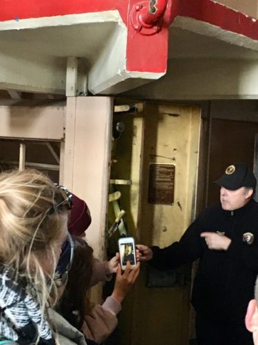 Volunteer showing the open box that controls the cell doors at Alcatraz