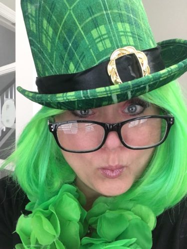 Courtney Mroch in green wig and Irish Leprechaun top hat for St. Patrick's Day