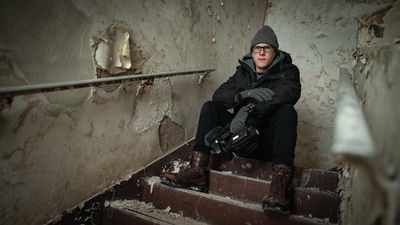 Tanner Wiseman on stairs inside Minnesota's Nopeming Sanatorium