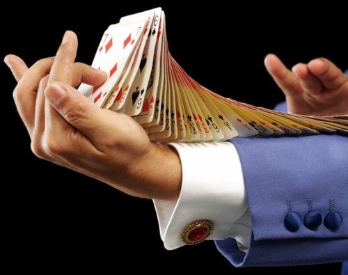 Magician with cards up his sleeve