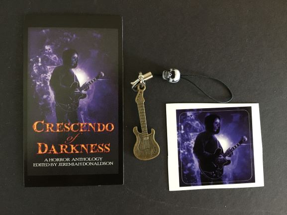 HorrorAddicts.net Crescendo of Darkness postcard cover and mini guitar