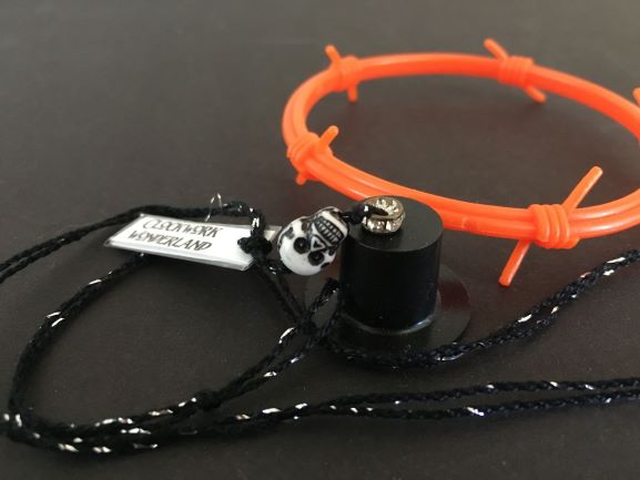 Orange barbed wire bracelet and top hat from HorrorAddicts.net with top hat from ClockworkWonderland