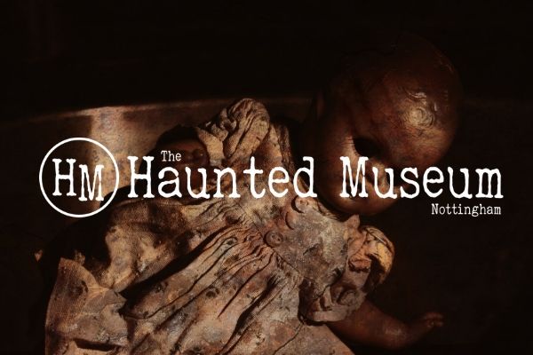 Haunted Museum in Nottingham logo with creepy doll background