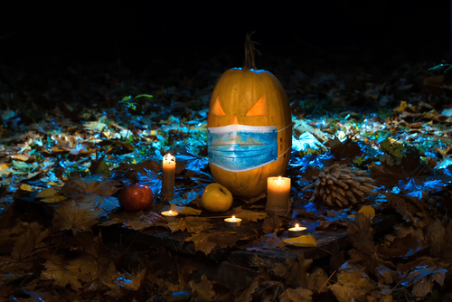 Halloween pumpkin with medical face mask