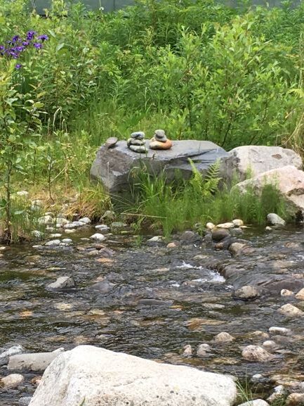 Inukshuks on bank of creek at Mt McKinley Wilderness Lodge