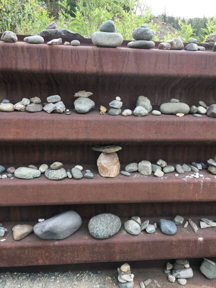 Inukshuks in path-side wall along George Parks Highway 5