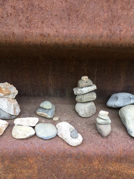 Group of inukshuks in wall along George Parks Highway