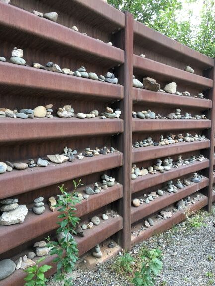 Inukshuks in path-side wall along George Parks Highway 3