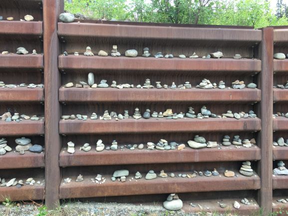 Inukshuks in path-side wall along George Parks Highway