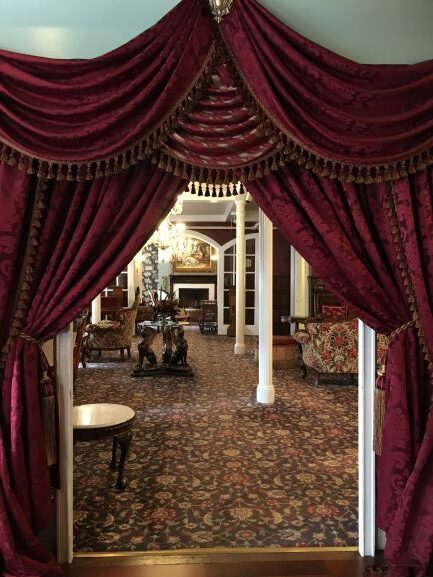 Curtains leading to lounge area in Queen Anne Hotel San Francisco