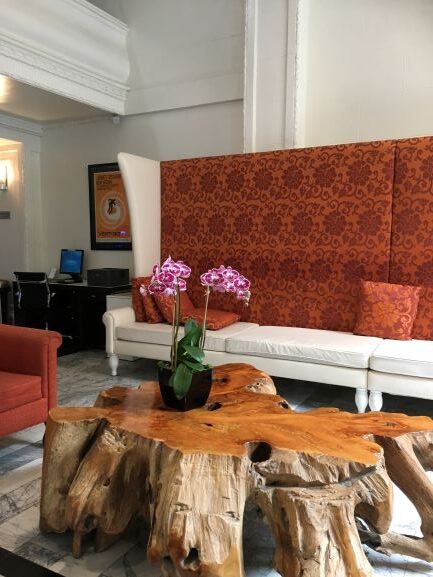 High-backed orange and white sofa in the Hotel Vertigo's lobby.