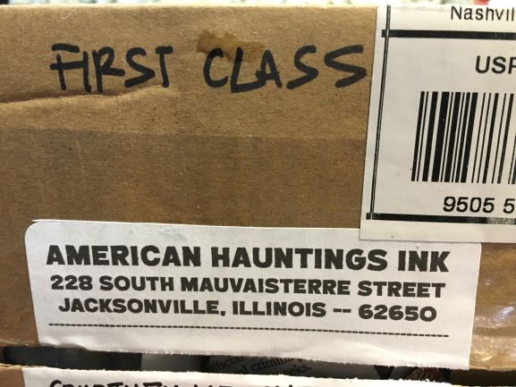 American Hauntings Ink label on first class box