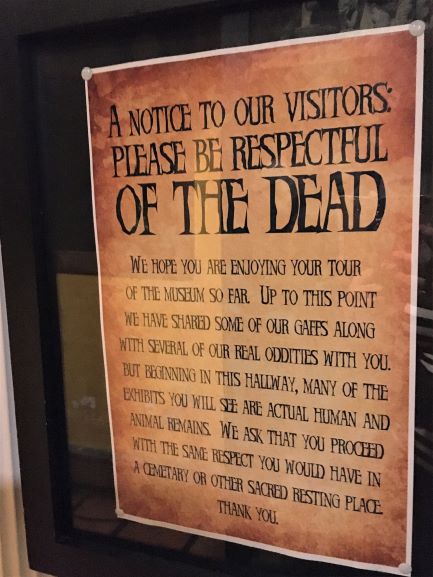 Museum of the Weird respect for the dead sign