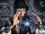 A gypsy psychic witch woman gazing into a crystal ball against an occult day background