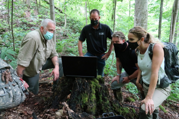 The team reviews evidence found during their investigation.