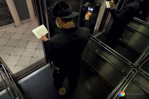 Zak playing the elevator game in the Cecil Hotel