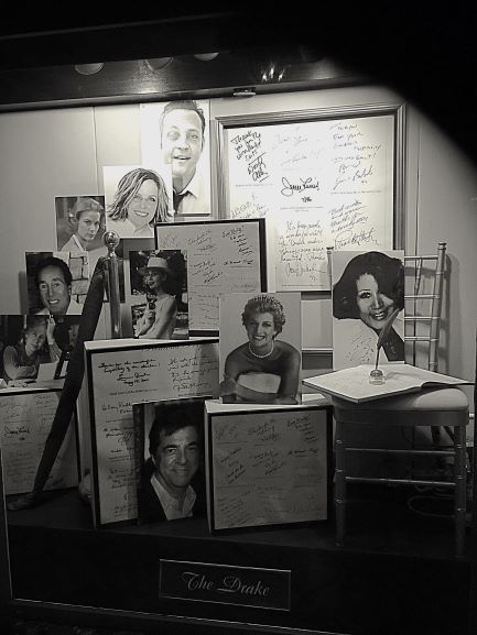 A display of photos and letters of famous people who have visited The Drake 