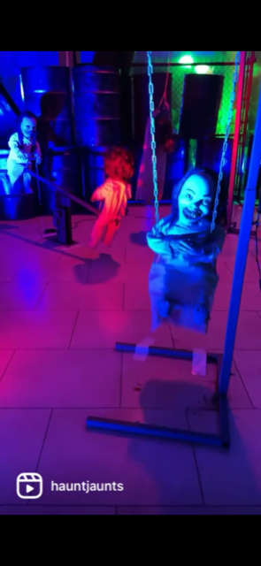 Creepy girl on swing at Haunted playground at Distortions