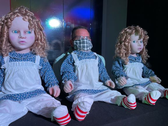 Creepy dolls photo op at Distortions Monster World