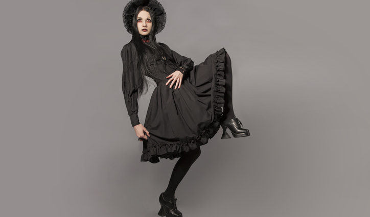 Woman marching in retro goth outfit