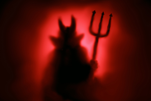 Silhouette of a devil with a pitchfork