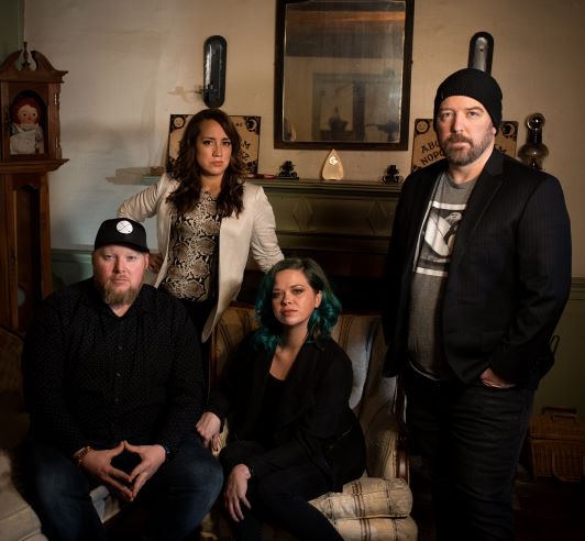 Kendall and Vera Whelpton with Brian Murray and Richel Stratton in the living room of the Conjuring House