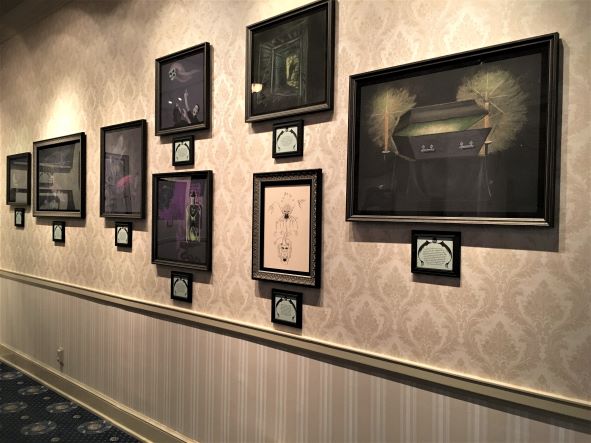 Coffin group of photos on Haunted Mansion Materializes exhibit