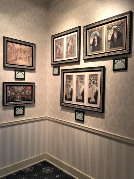 Werewolf and other Haunted Mansion concept portraits at Happy Haunts Materialize exhibit