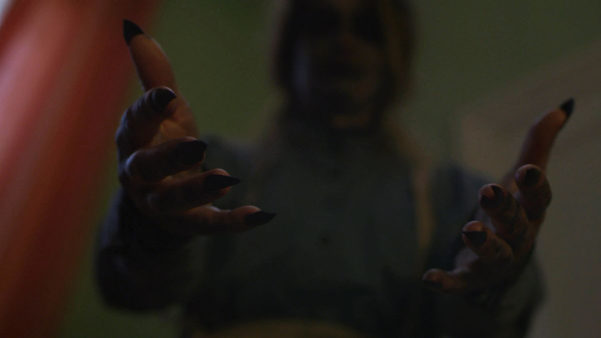 Bathsheba still of scary woman's hands reaching out
