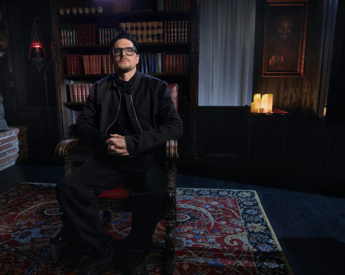 Zak Bagans in chair in room of Haunted Museum