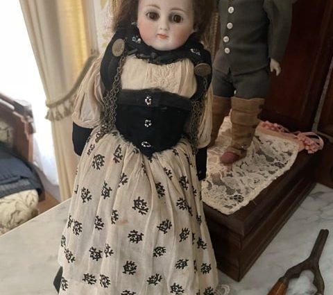 Creepy baby doll with human hair from Sanilac County Museum FB announcement