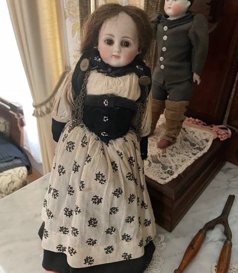 Creepy baby doll with human hair from Sanilac County Museum FB announcement