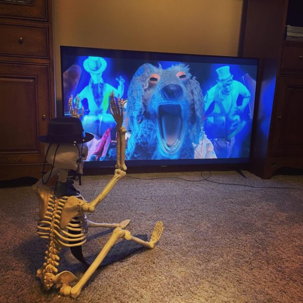 Skeleton watching screaming goat from Muppets Haunted Mansion