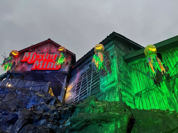 Mystery Mine and pumpkins lit up at night