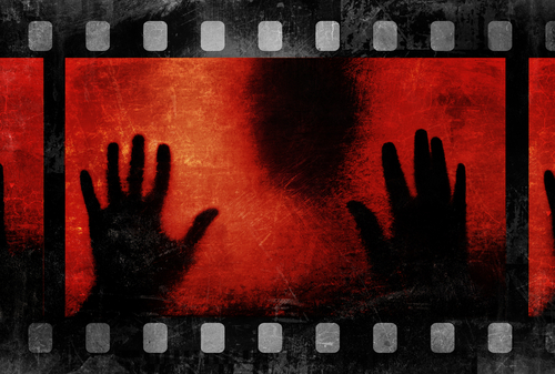 black silhouette and distressed red film strip portraying horror movies