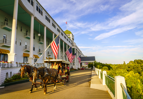 Horse-drawn carriage in front of the Grand Hotel on Mackinac Island, Michigan.