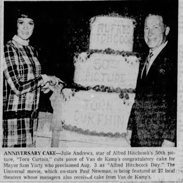 Newspaper photo of Julie Andrews cutting cake to celebrate torn curtain and Alfred Hitchcock Day
